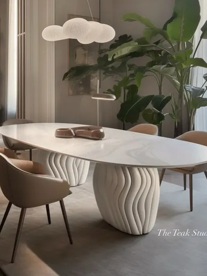 This design showcases what's possible with custom furniture. An oval marble dining table rests on unique, wave-like sculptural bases, creating a piece of functional art that is both modern and organic.
