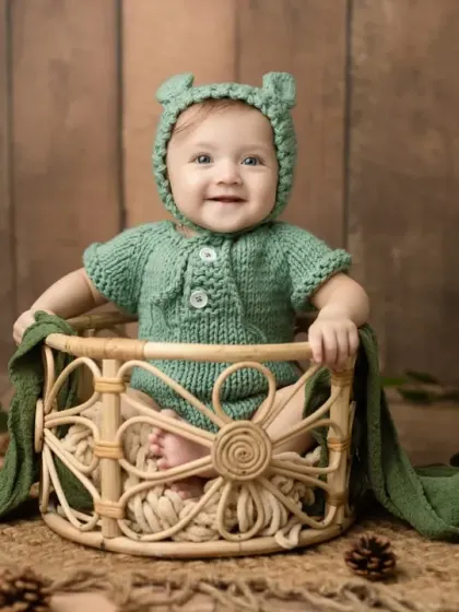 A full view of the woodland bear setup, with a rustic wooden background and green leafy accents.