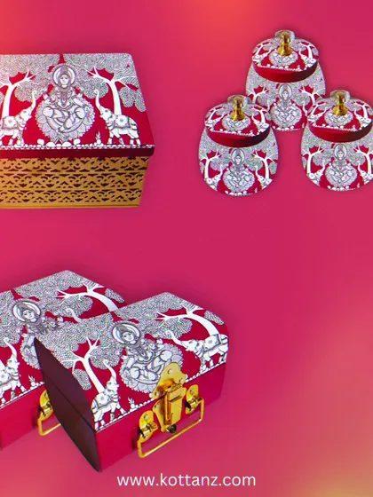 Our theme for this year's Varalakshmi pooja is Gajalakshmi. This collection, featuring the goddess flanked by elephants, includes a range of thamboolam boxes and pooja essentials.