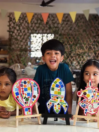 Another shot of our happy mosaic makers. The excitement and pride on their faces are what make these workshops so rewarding.