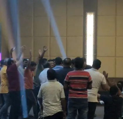 The lighting creates a tunnel effect, focusing energy on the dance floor.