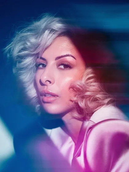 An artistic portrait with motion blur and colored lighting. Experimenting with visuals is key to finding your unique artist brand.