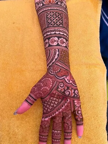 This design combines floral motifs with intricate check patterns for a contemporary feel.
