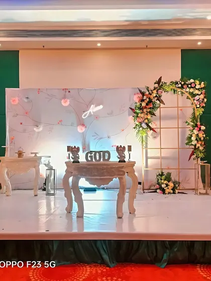 An elegant and classy floral decoration for Alona's Holy Communion. The setup features a beautiful floral arch and minimalist furniture for a sophisticated and graceful celebration.