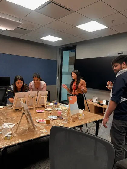 Guiding a small group through the painting process. I make sure to give every table the attention they need to feel comfortable and creative.