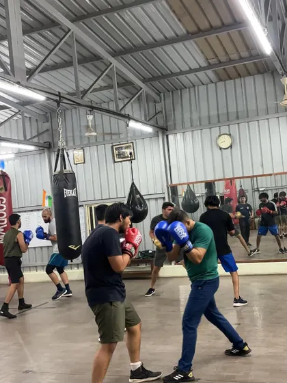 A wider view of our technical sparring sessions, with multiple pairs practicing their skills simultaneously.
