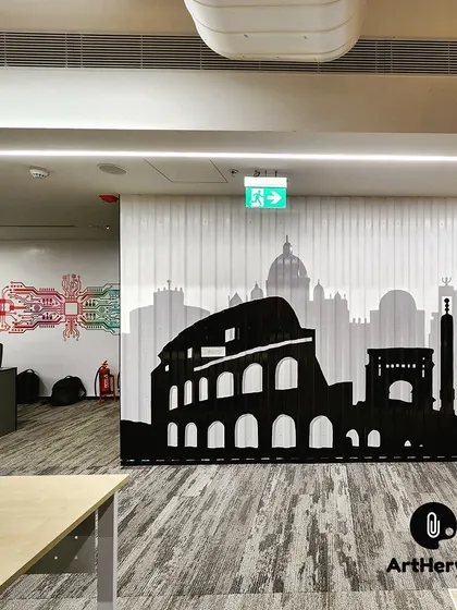 Another angle of the Rome cityscape silhouette, showing its placement next to a service bar in the office. The backlighting on the corrugated metal surface creates a beautiful shadow effect.