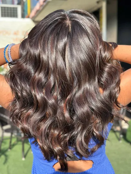 A stunning after shot of a global color without bleach. The hair is incredibly shiny, healthy, and has a rich, deep color.