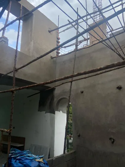 An interior shot during the structural phase, showing the raw concrete forms and openings that will eventually become light-filled, multi-height spaces.