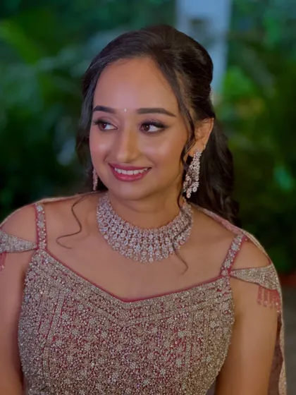 Another angle of Sneha's reception look, highlighting the radiant finish on her skin.