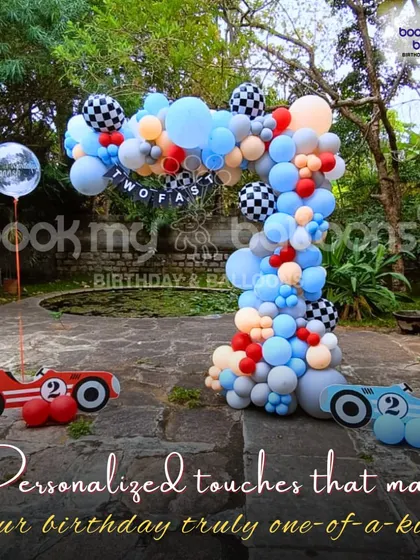 This outdoor "Two Fast" race car theme demonstrates the personalized touches that make your birthday truly one of a kind. The custom car cutouts and balloon arch create a fun and unique photo opportunity.