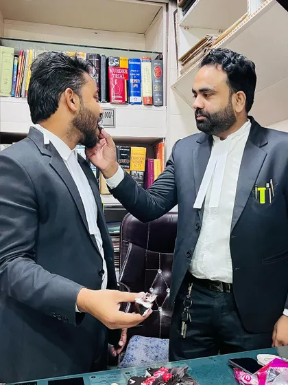 A gesture of blessing and support from a senior advocate during my band ceremony.