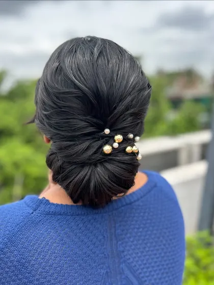 A side profile of the elegant low bun, showcasing its beautiful silhouette.