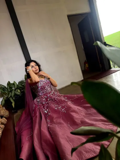 A different perspective of this elegant wine-colored gown. The way the full skirt drapes makes it look beautiful from every angle.