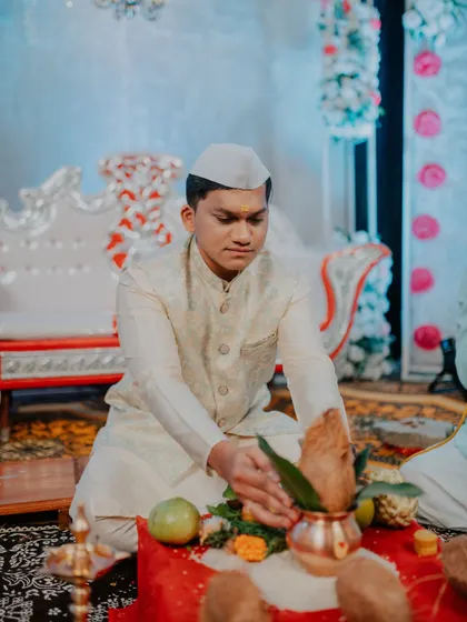 The groom-to-be participates in a traditional prayer during the engagement ceremony.