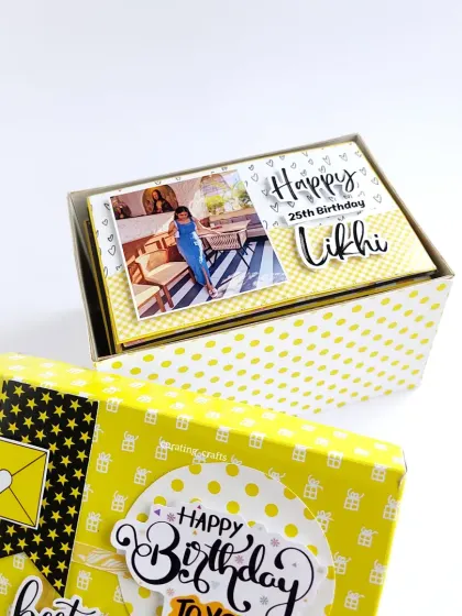 A bright and cheerful birthday hamper for a best friend. This box contains 25 handmade cards, each one decorated with photos and messages in a sunny yellow theme.