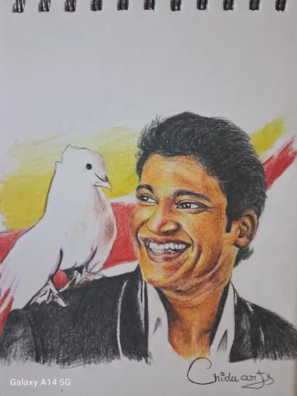 The completed color pencil drawing of Puneeth Rajkumar with a white dove. This artwork is filled with warmth, created as part of a multi-day drawing project.