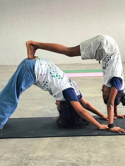 Another view of our advanced downward dog and handstand combination, showcasing the incredible body control and strength our young gymnasts develop.