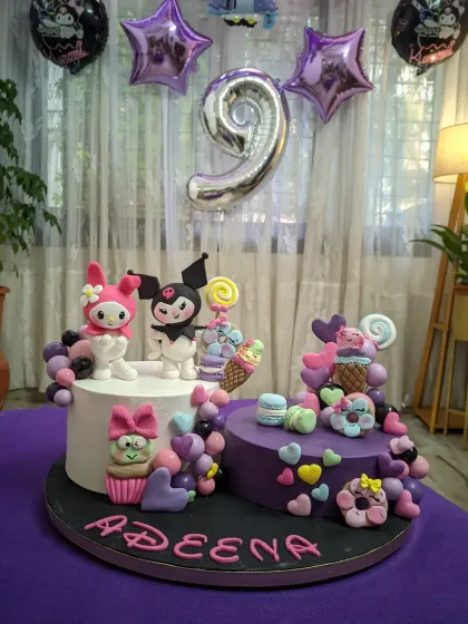 This Kuromi and My Melody cake was made for my daughter's 9th birthday. It features two separate cakes and lots of handcrafted fondant details, showing how I can combine different elements to create a truly personal and magical centerpiece.