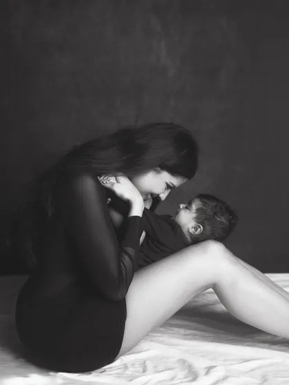 A tender moment between mother and child, captured in a classic black and white style that feels both modern and timeless.