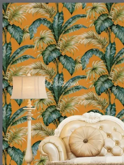 A vibrant tropical leaf wallpaper with a bold orange background, shown in a classic living room setting.