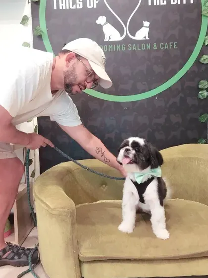 A happy client posing with his freshly groomed Shih Tzu. We love capturing these moments of joy between pets and their parents.