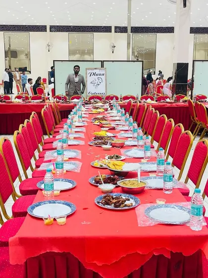 A full view of the hall with our catering setup. Our branding is subtly placed, and the tables are perfectly aligned and ready for the celebration.