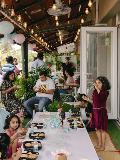 My breezy rooftop is perfect for party time. Here, kids and adults enjoy a meal together under the fairy lights after a fun session of arts and crafts.
