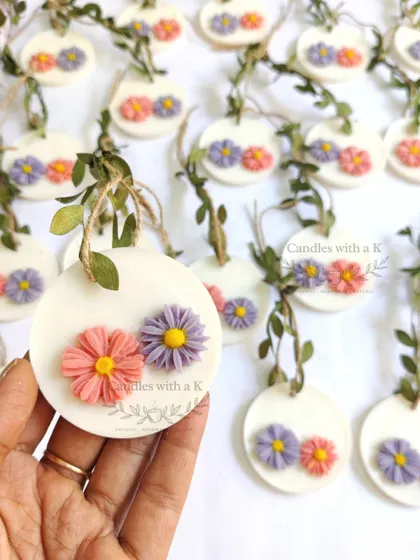 A beautiful array of mini floral wax sachets, perfect for adding a touch of fragrance to any baby shower gift set.