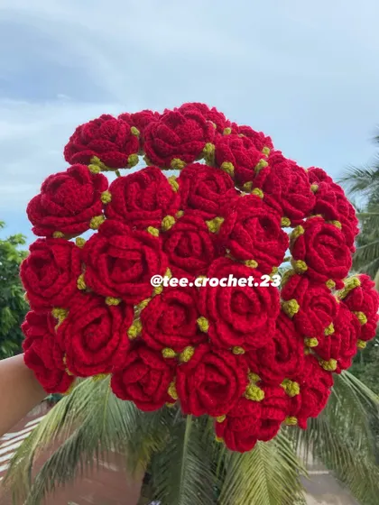 A full bouquet of classic red roses with green sepals.