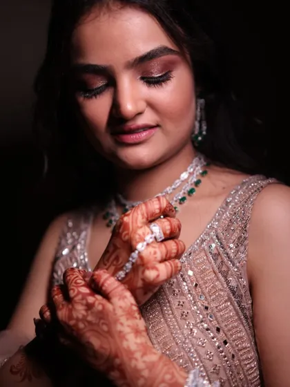 A detailed shot of the engagement makeup. The focus is on the shimmery, bronze eyeshadow and the flawless, dewy skin that looks incredible up close.