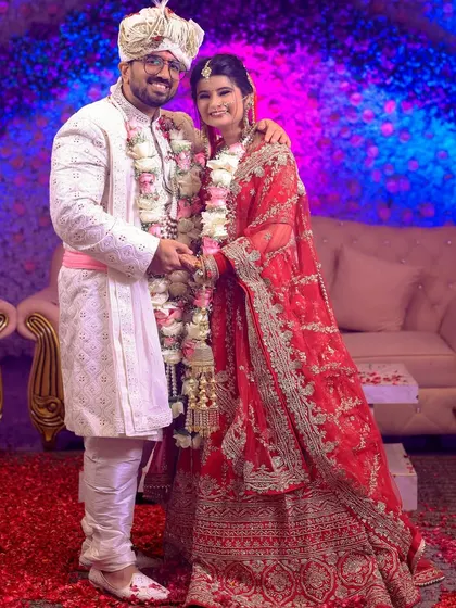 A happy, formal portrait of the bride and groom after their wedding ceremony.