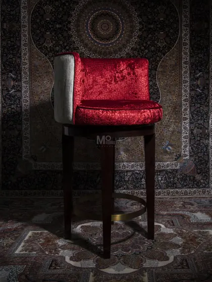 Inspired by classic royal aesthetics, the Old Fashioned Bar Chair features vibrant red velvet upholstery and a polished brass footrest. It's a perfect blend of classic and contemporary style for any bar or lounge.