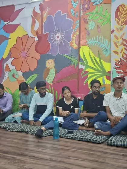 A group of young people sits in a circle for a 'Be A Jagrik' session. This format encourages open dialogue and ensures that every participant feels heard and respected.