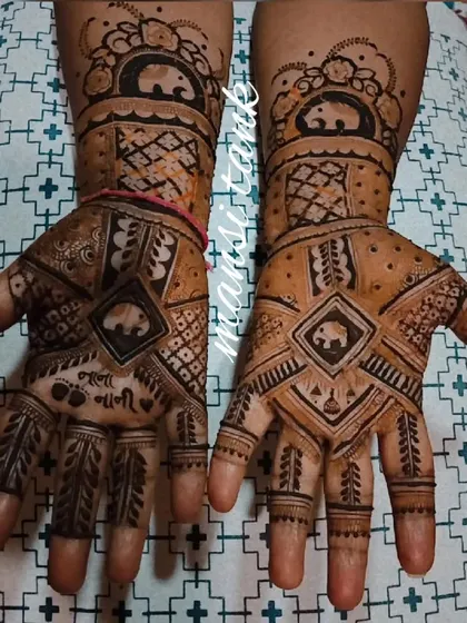 The full view of the baby shower mehendi, featuring elephant motifs which symbolize good luck and blessings for the new baby.