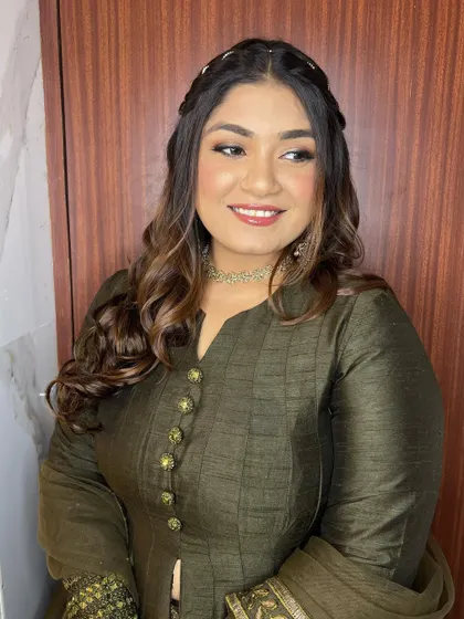 A candid, smiling shot. The makeup is designed to look beautiful and natural, even in unguarded moments.