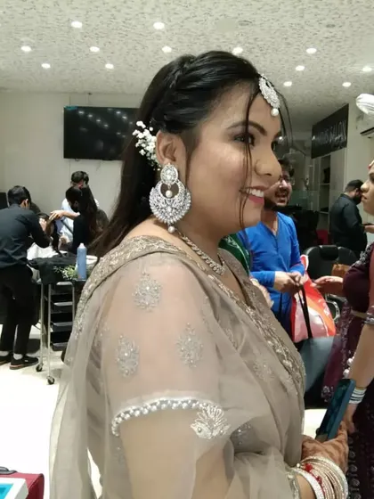 A side view of the engagement party look, showing the elegant hairstyle with a simple twist and how the makeup looks from every angle.