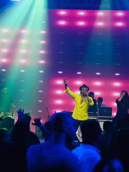 The crowd is a key part of the show. Here I am, getting them hyped up during a corporate event.