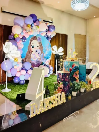 A side view of the expansive mermaid stage decoration, showing how it fills the space to create an immersive environment.