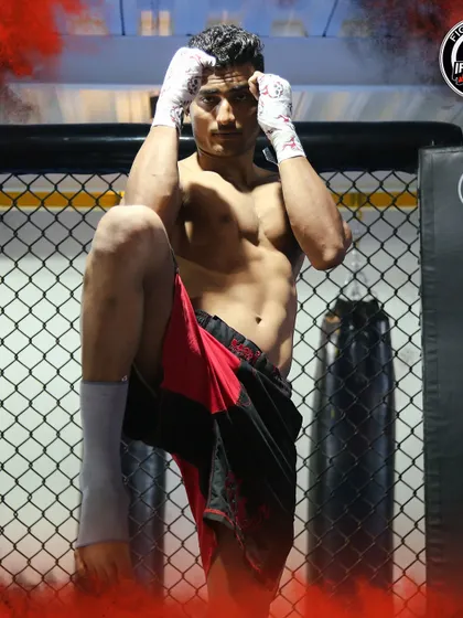 A Muay Thai fighter in a classic ready stance. We train our athletes in multiple disciplines to be well-rounded competitors.