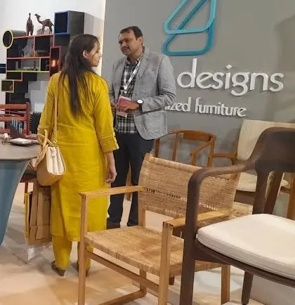 A visitor examining the craftsmanship of a woven armchair, one of the many designs we had on display.