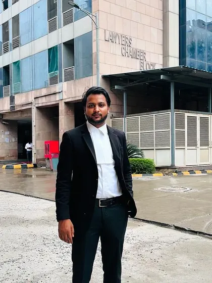 A professional photo of me outside the Lawyers' Chamber Block, ready to meet with clients and prepare for court appearances.
