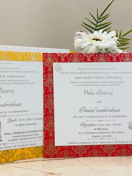 The inserts for our yellow and red invitation set, featuring classic brocade patterns and elegant typography.
