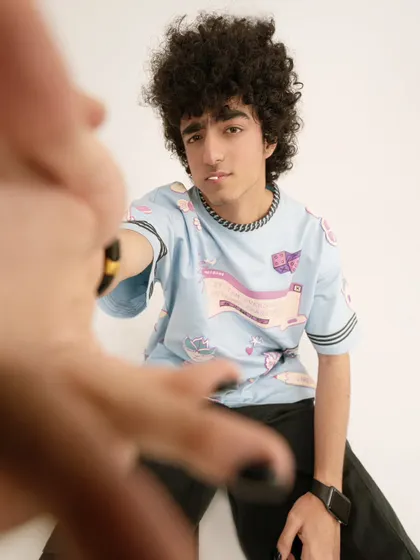 Another creative shot for a streetwear campaign, using a hand in the foreground to create depth and a unique perspective.