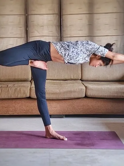 A half-lotus variation of Warrior III. This pose deeply challenges your balance and concentration while strengthening the entire standing leg.