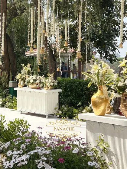 The welcome area, with multiple consoles and hanging floral decorations, creating a beautiful and immersive entrance for guests.