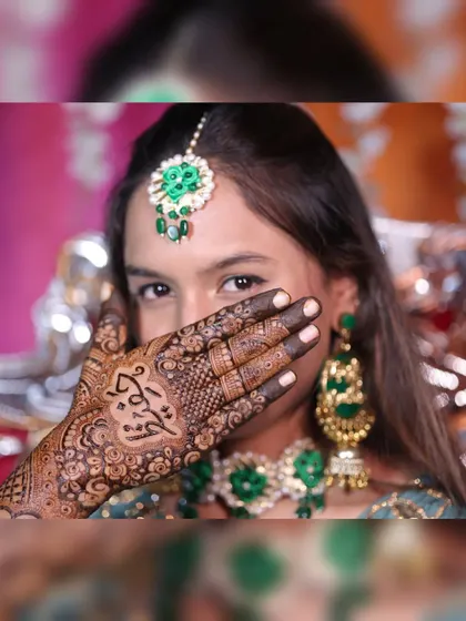 A close-up shot of Hafza, highlighting the name design on her palm.