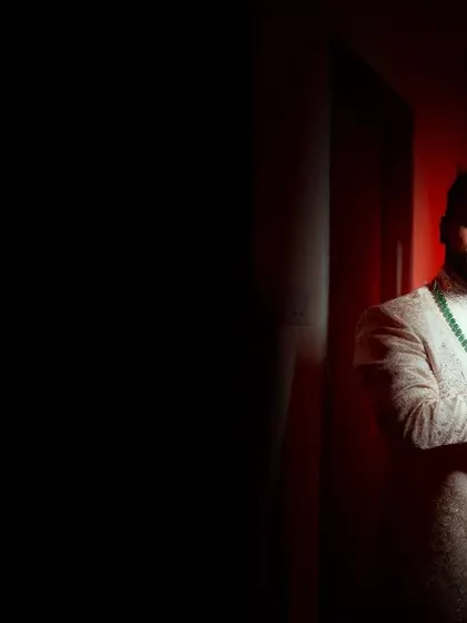 A moody and artistic portrait of the groom, with a motion blur effect adding a dynamic and modern feel.