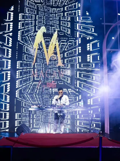 Speaking to the crowd while the intricate visuals play behind me. The VDJ setup allows me to interact with the audience while maintaining a strong visual presence.