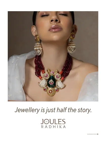 A grand, colorful necklace with a central carved pendant, showing that the jewelry is just half the story; the other half is our service.